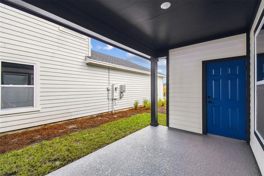Exterior details and patio area of a home in Weslyn Park in Sunbridge 34', St. Cloud (Image 4).