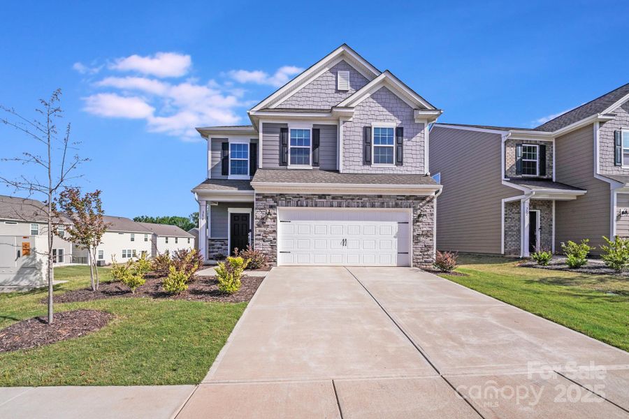 Front exterior of a new home in Elizabeth: Walk, Fort Mill, SC, highlighting curb appeal (Image 22). Front exterior of a new home in Elizabeth: Walk, Fort Mill, SC, highlighting curb appeal (Image 22).