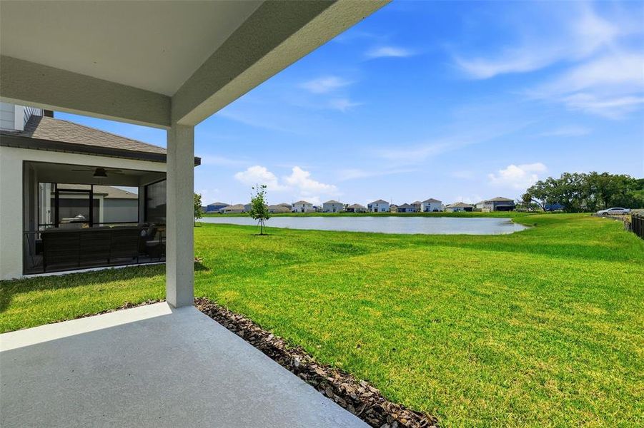 Exterior details and patio area of a home in Oakfield Lakes, Parrish (Image 3).