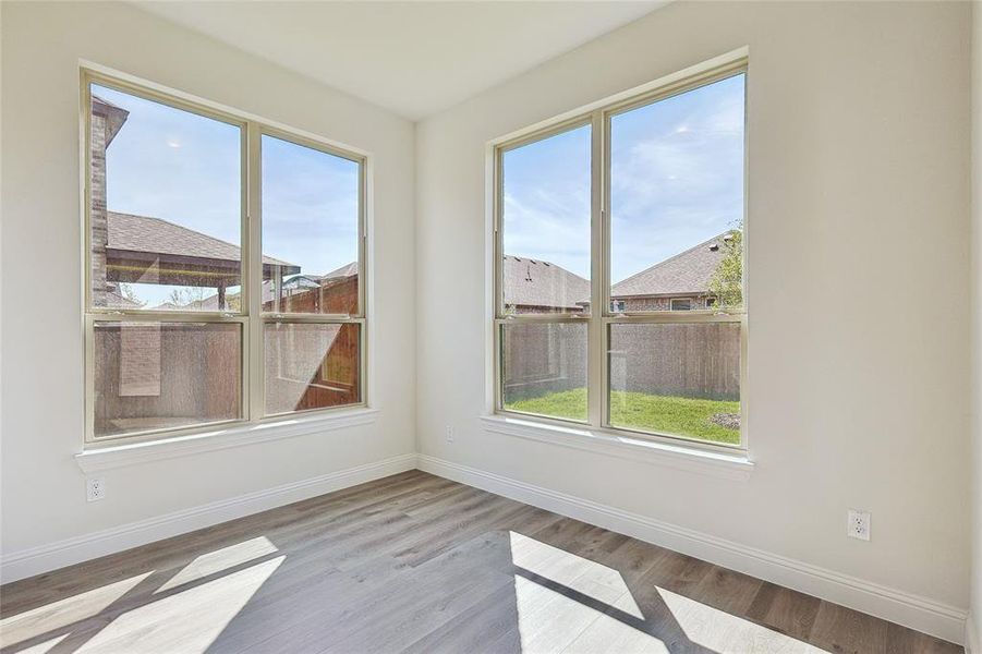 Unfurnished room with light hardwood / wood-style floors