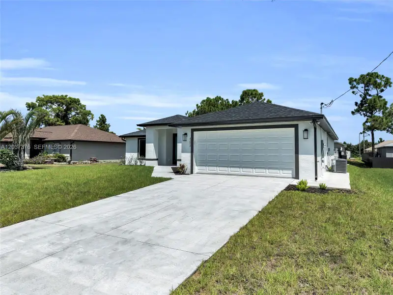 Front exterior of a new home in , Lehigh Acres, FL, highlighting curb appeal (Image 28).