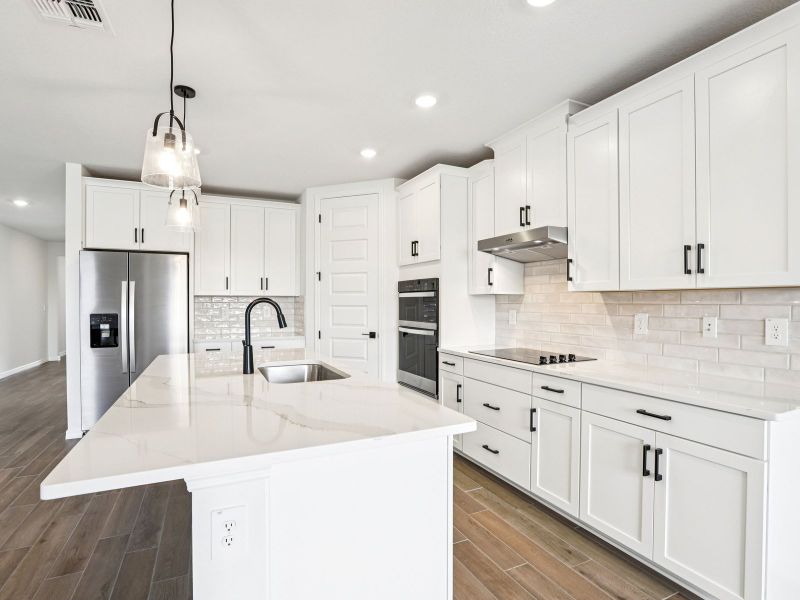 Furnished interior view inside a new home in Oakfield Trails - Signature Series, Parrish (Image 4).
