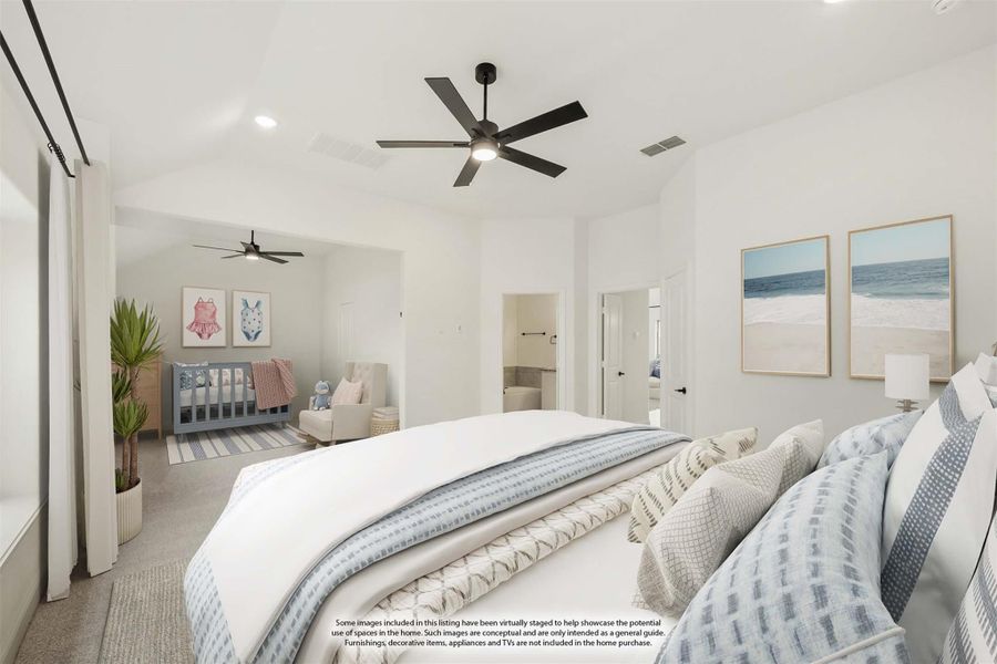 Spacious bedroom with ceiling fan, carpet flooring, ensuite bathroom, and open sitting area with crib in background.
