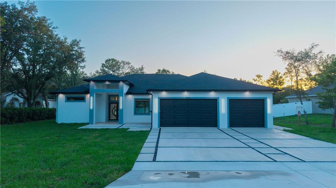 Front exterior of a new home in , Weeki Wachee, FL, highlighting curb appeal (Image 32).