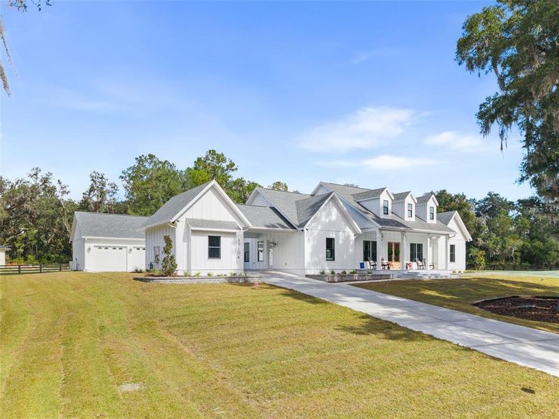 Front exterior of a new home in , Newberry, FL, highlighting curb appeal (Image 1). Front exterior of a new home in , Newberry, FL, highlighting curb appeal (Image 1).