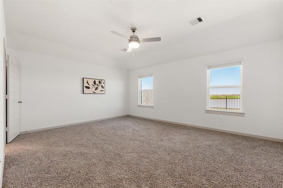 Primary Bedroom with view looking out to backyard and the beautiful view!