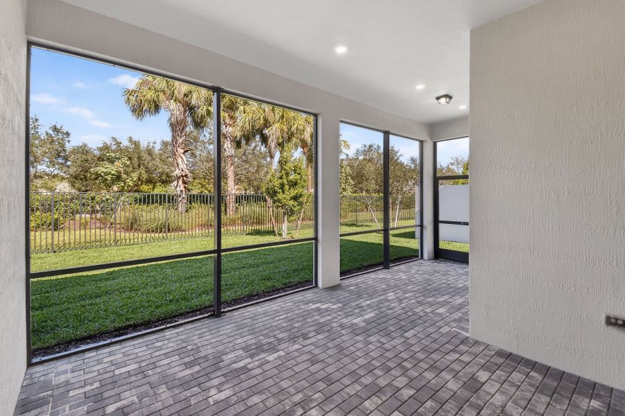 Exterior details and patio area of a home in Greyhawk Landing, Lake Worth (Image 4).