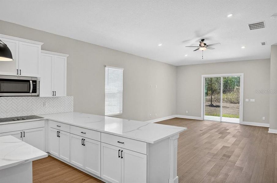 Furnished interior view inside a new home in Stables at Cary Forest, Bryceville (Image 12).