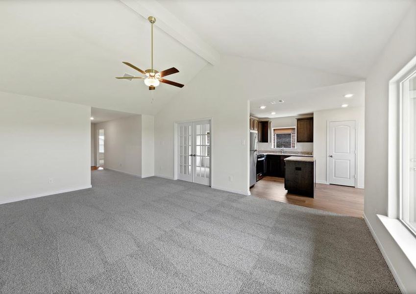 The open layout connects the family room with the kitchen and dining room.