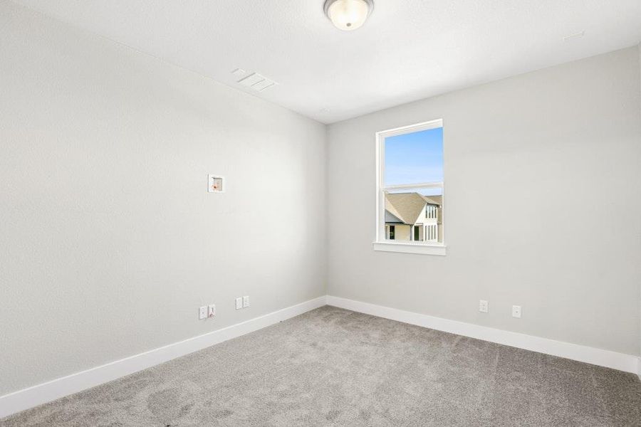 Empty room featuring carpet floors and baseboards Empty room featuring carpet floors and baseboards