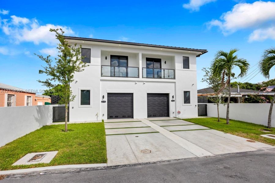 Front exterior of a new home in , Miami, FL, highlighting curb appeal (Image 24).
