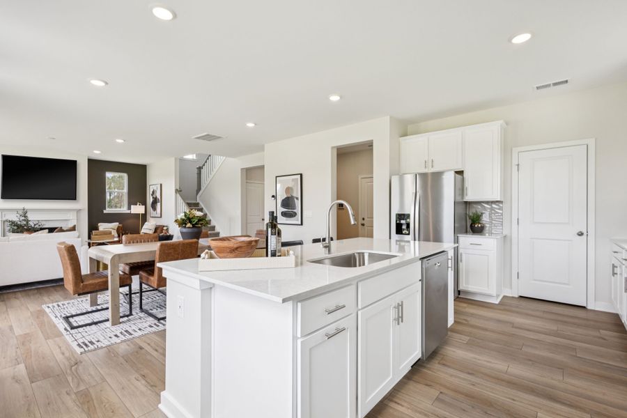 A kitchen with white cabinets. A kitchen with white cabinets.