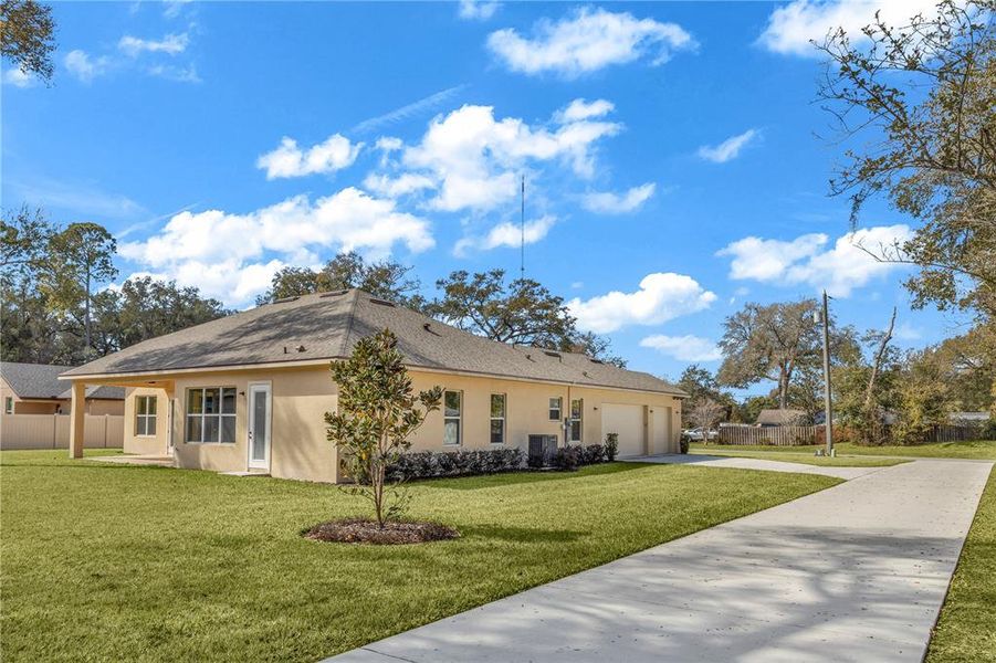 Front exterior of a new home in , Orange City, FL, highlighting curb appeal (Image 18).
