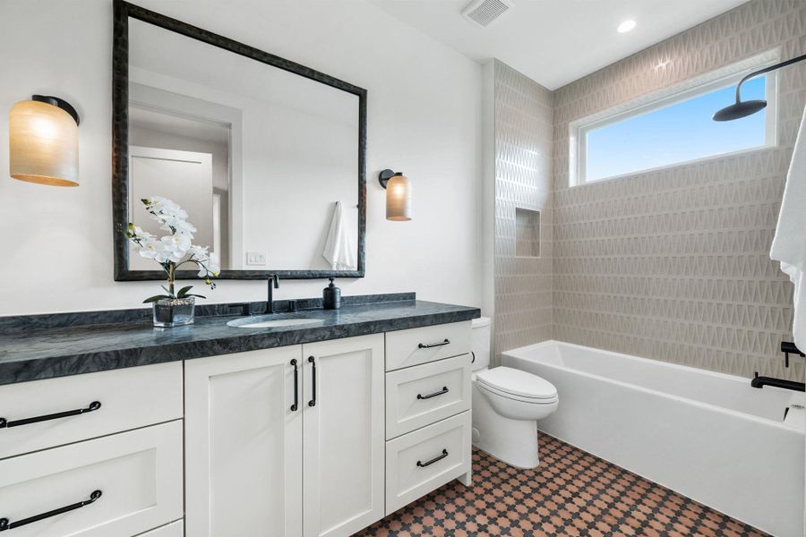 Bathroom with vanity and shower / washtub combination Bathroom with vanity and shower / washtub combination