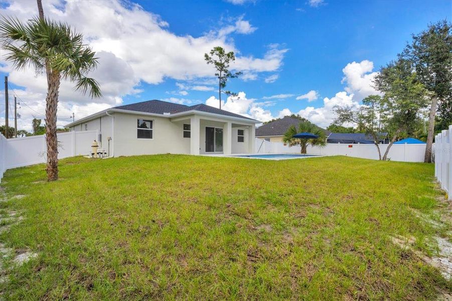 Exterior details and patio area of a home in , North Port (Image 26).