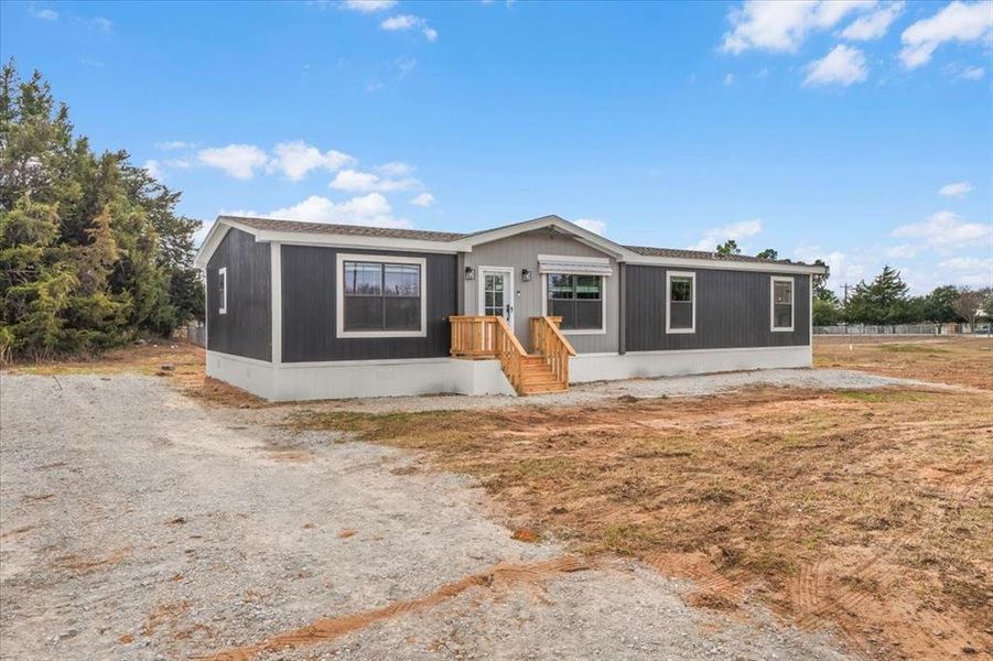 Exterior details and patio area of a home in , Joshua (Image 2). Exterior details and patio area of a home in , Joshua (Image 2).