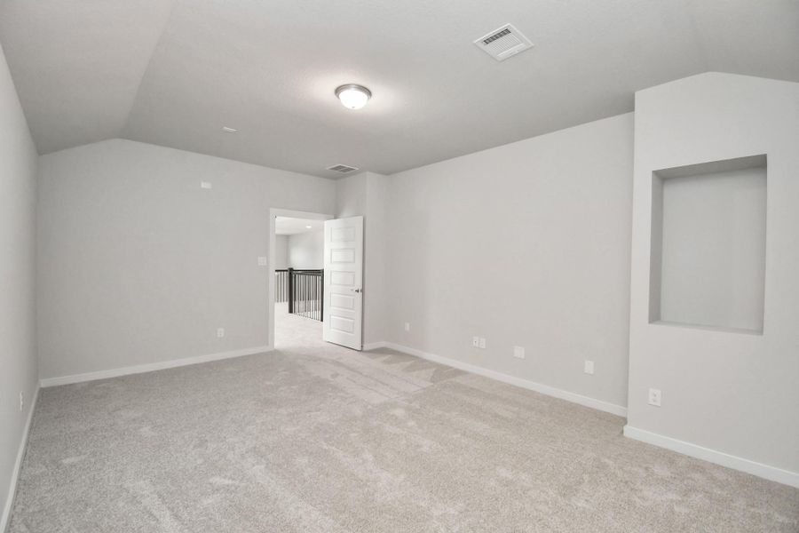 Generously sized secondary bedrooms featuring spacious closets, soft and inviting carpeting underfoot, large windows allowing plenty of natural light, and the added touch of privacy blinds for your personal retreat. Sample photo of completed home with similar floor plan. Actual colors and selections may vary.