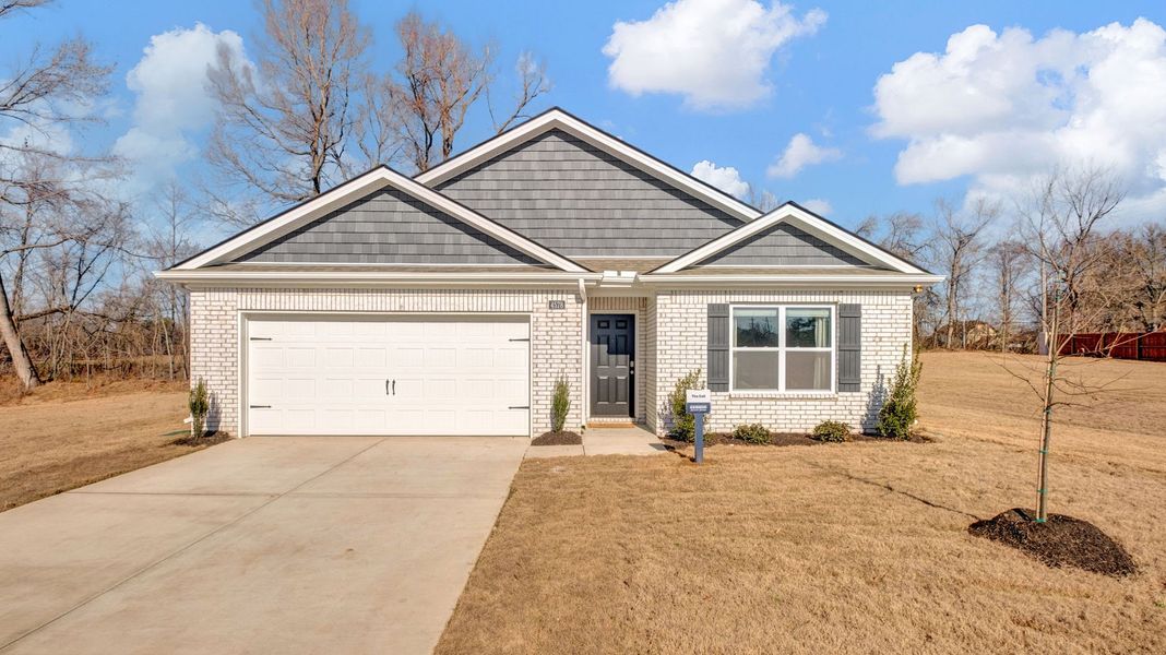 Front exterior of a new home in Riggs Pointe, Millington, TN, highlighting curb appeal (Image 20).