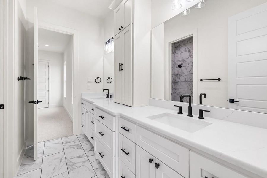 Primary ensuite bathroom featuring double vanity, walk-in shower & free standing tub Primary ensuite bathroom featuring double vanity, walk-in shower & free standing tub