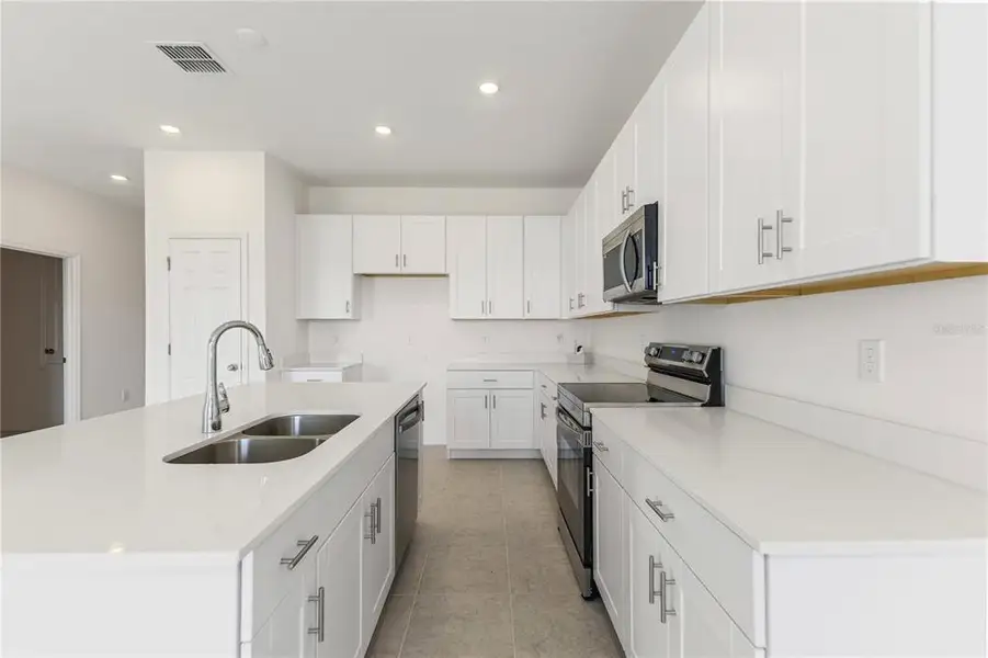 Furnished interior view inside a new home in Mirror Lake Village, Fruitland Park (Image 11).
