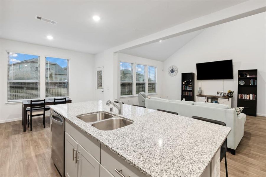 This kitchen provides an oversized center island that provides tons of seating and also lends to the overall open feel of this home.