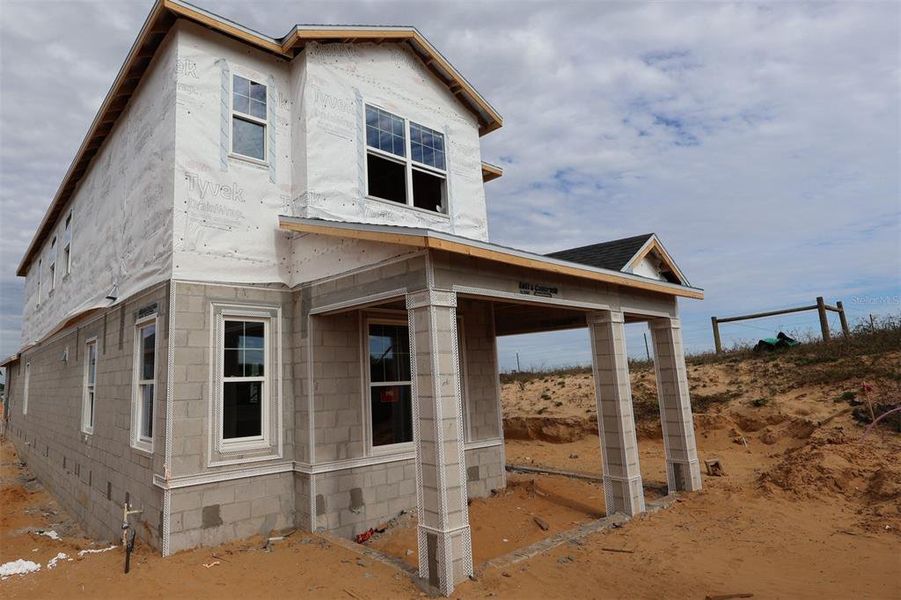 In-progress construction of a new home in Lake Star at Ovation, Winter Garden, FL (Image 6).