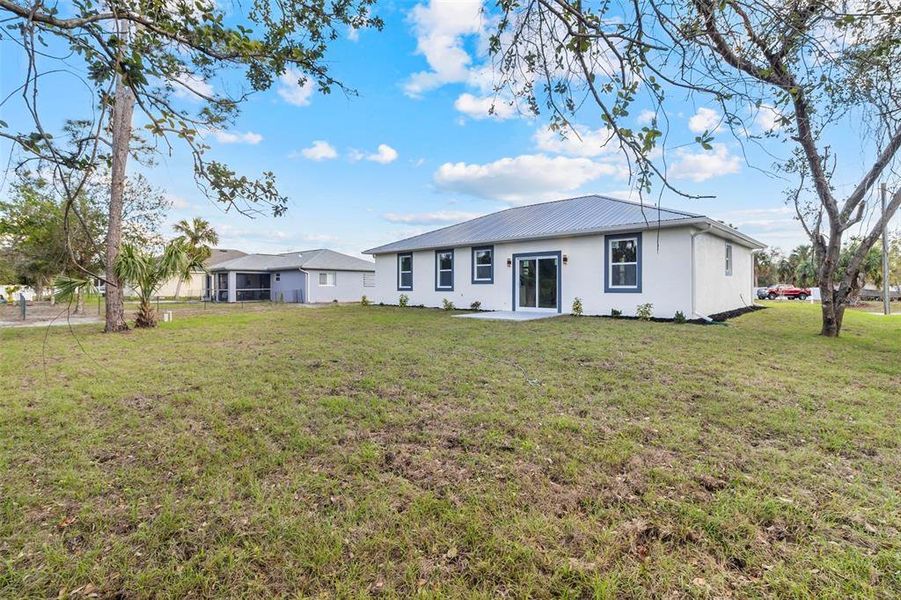 Front exterior of a new home in , North Port, FL, highlighting curb appeal (Image 16). Front exterior of a new home in , North Port, FL, highlighting curb appeal (Image 16).