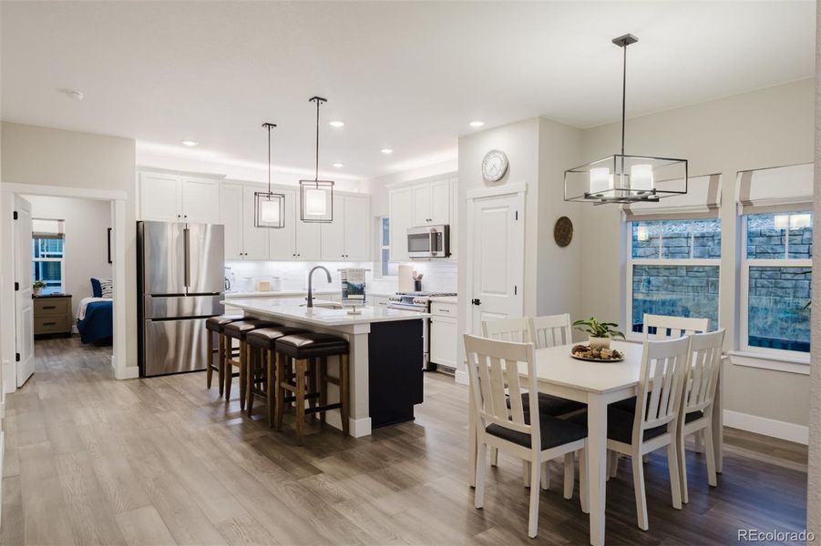 The dining area is open to the kitchen and has a walk-out to the patio. The dining area is open to the kitchen and has a walk-out to the patio.