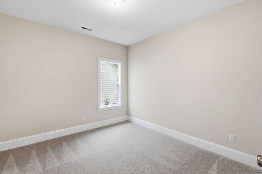 Representative unfurnished interior of a home built from the Kauai by Bill Clark Homes in The Sanctuary at Sunset Beach, Sunset Beach (Image 24).