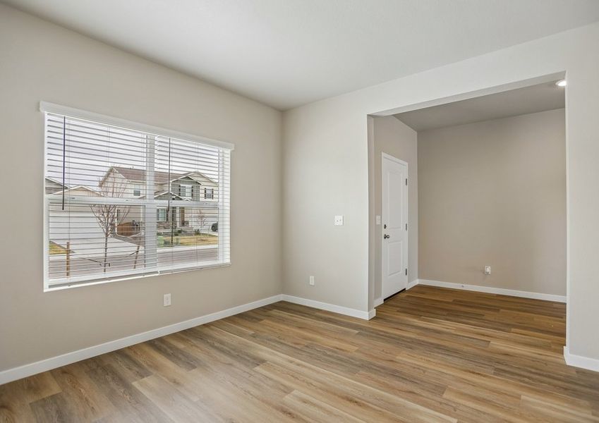 There is a dining room in the front of the home off the kitchen
