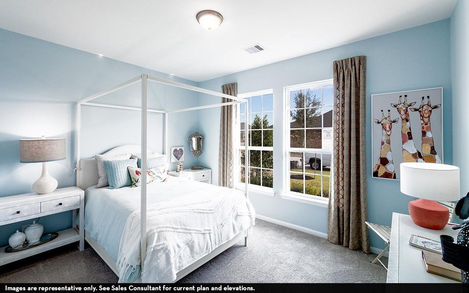 Bedroom with carpet floors, multiple windows, and baseboards Bedroom with carpet floors, multiple windows, and baseboards