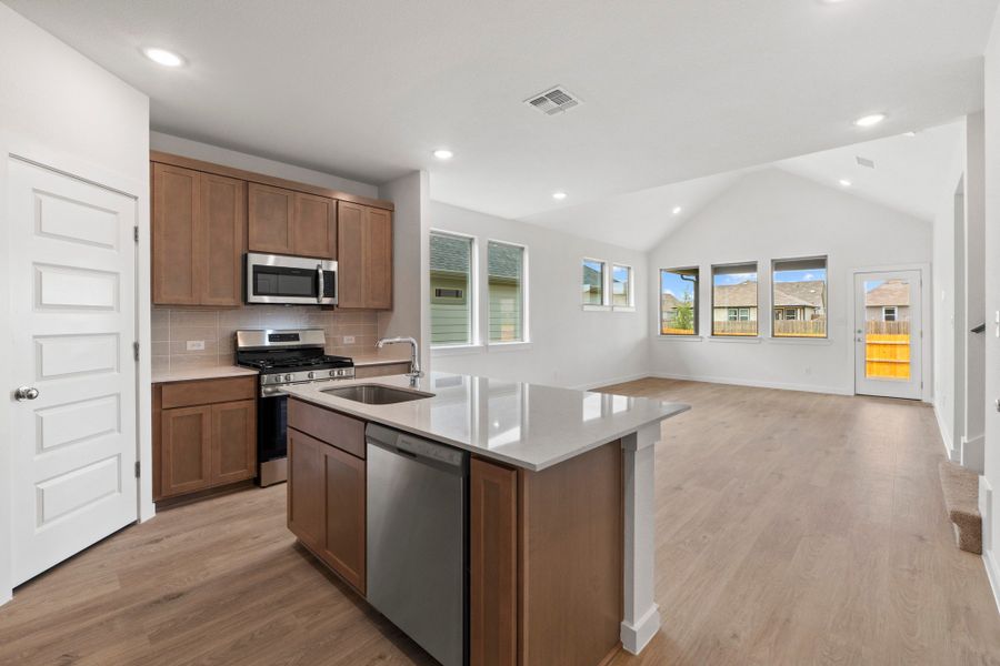 Kitchen in the Pearl home plan by Trophy Signature Homes – REPRESENTATIVE PHOTO