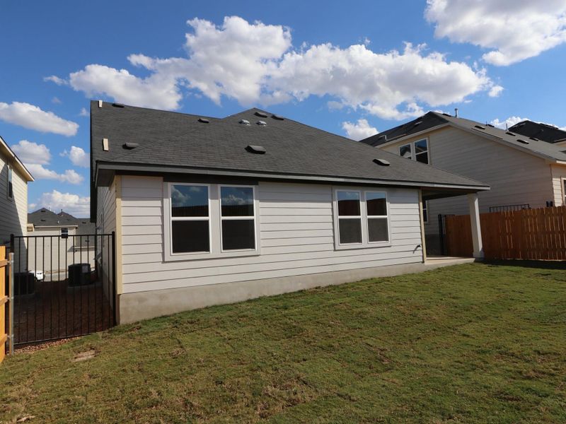 Exterior details and patio area of a home in Cascades at Onion Creek, Austin (Image 4).