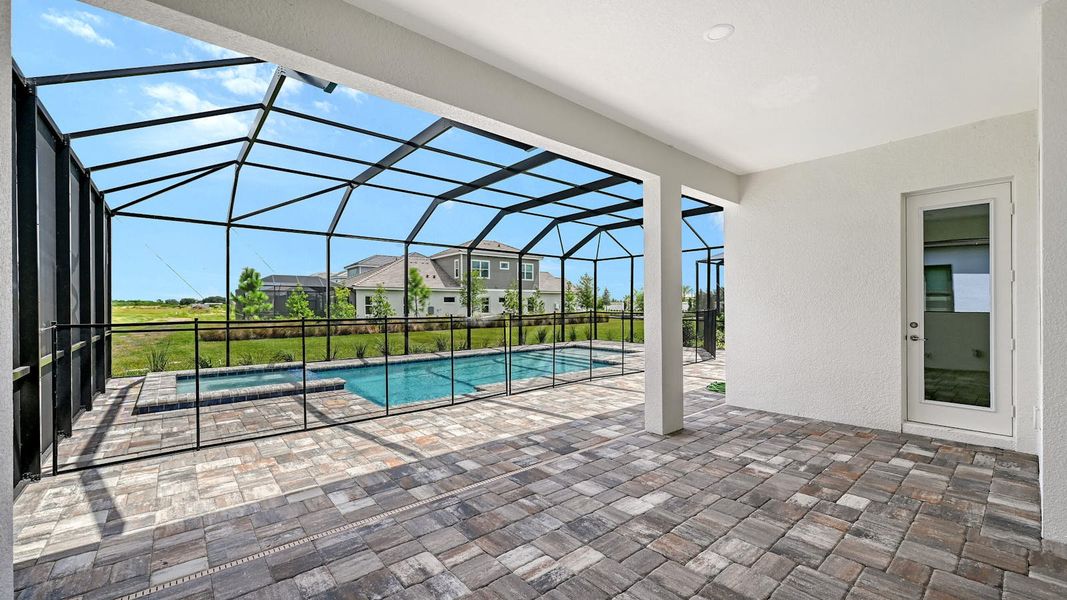 Exterior details and patio area of a home in Palm Grove Real Estate and Homes for Sale in Lakewood Ranch, FL - Neal Communities, Bradenton (Image 3).