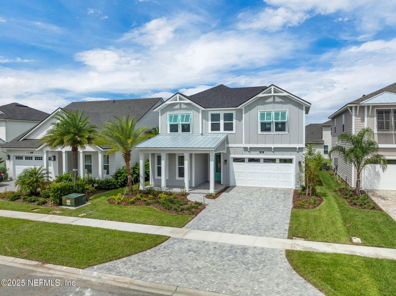 Front exterior of a new home in Seabrook Village at Seabrook, Ponte Vedra, FL, highlighting curb appeal (Image 2).