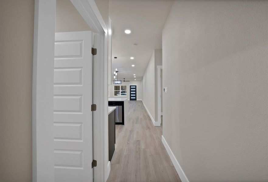 Hallway featuring recessed lighting and light wood-type flooring