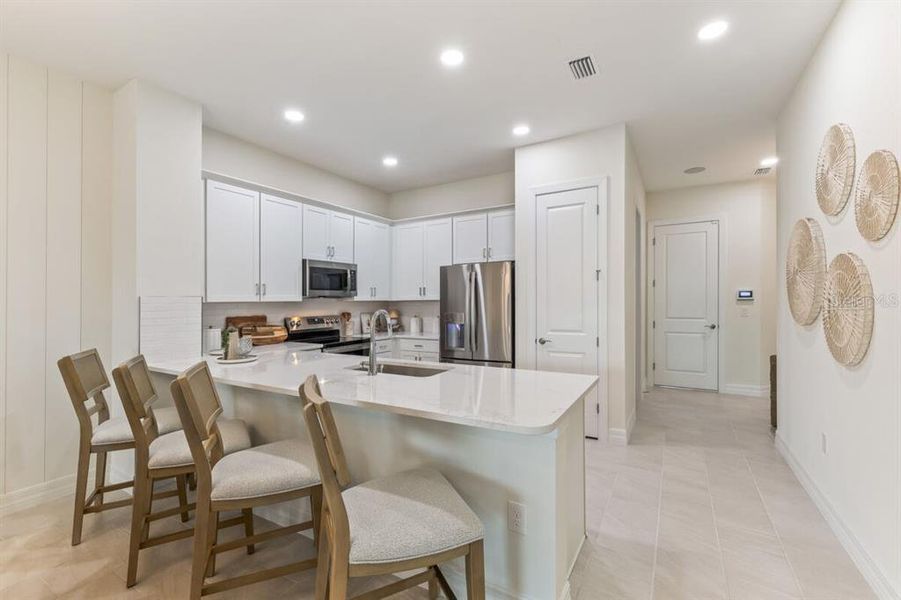 Furnished interior view inside a new home in Kings Gate, Port Charlotte (Image 12).