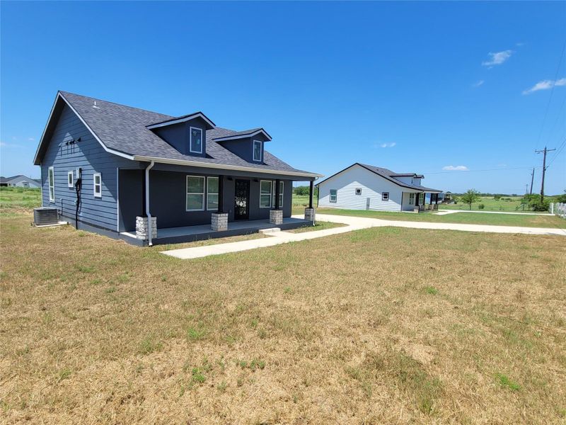 A classic facade with a covered porch offers inviting curb appeal.
