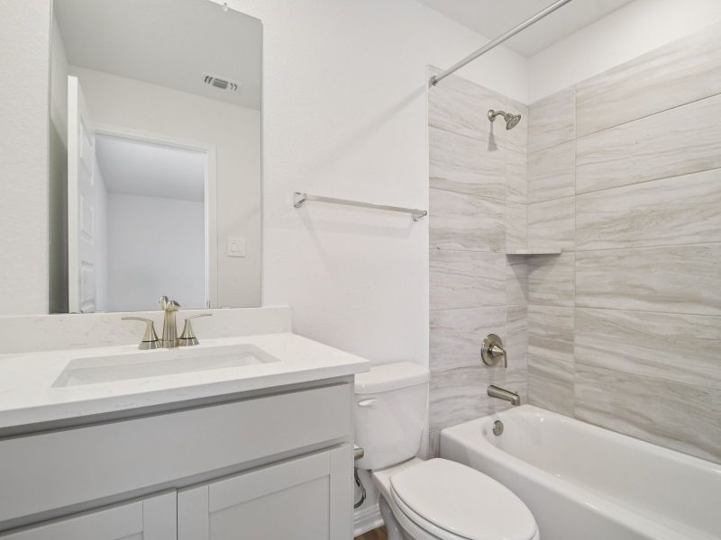 Furnished interior view inside a new home in Riverbend at Double Eagle - Boulevard Collection, Cedar Creek (Image 7).