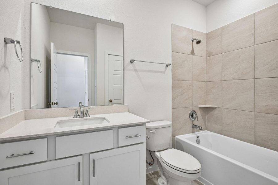 Furnished interior view inside a new home in Riviera Pines - Premier Series, Huffman (Image 10).