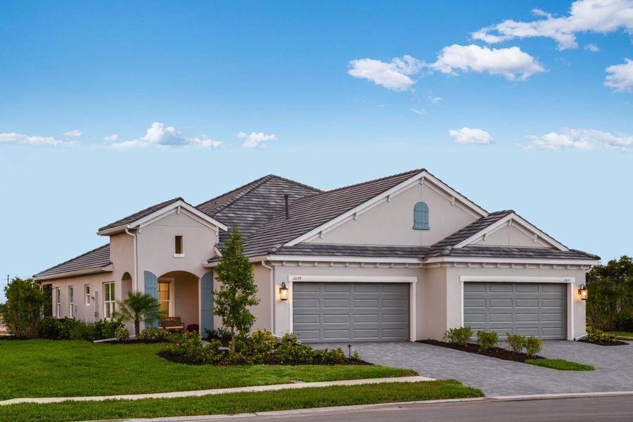 Front exterior of a new home in Wildleaf, Parrish, FL, highlighting curb appeal (Image 28).
