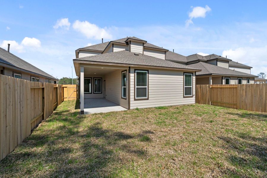 Exterior details and patio area of a home in Cypresswood Landing, Humble (Image 4).