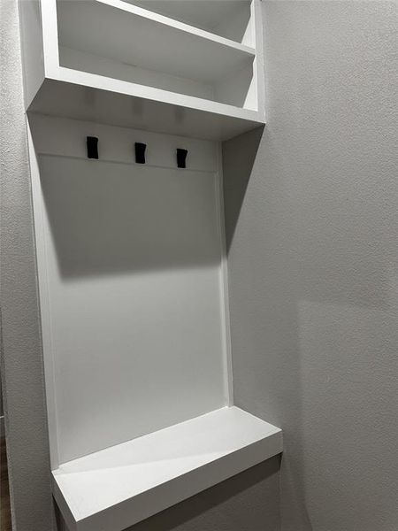 Mudroom with a textured wall Mudroom with a textured wall