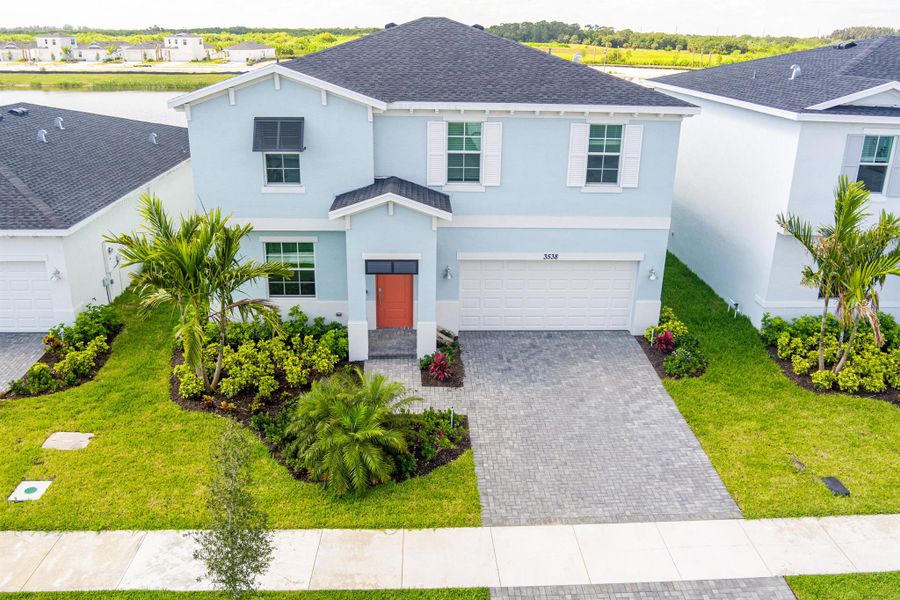 Front exterior of a new home in , Fort Pierce, FL, highlighting curb appeal (Image 16).