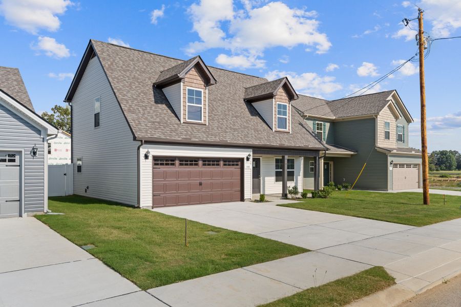 Front exterior of a new home in Stonehenge, Manchester, TN, highlighting curb appeal (Image 2). Front exterior of a new home in Stonehenge, Manchester, TN, highlighting curb appeal (Image 2).