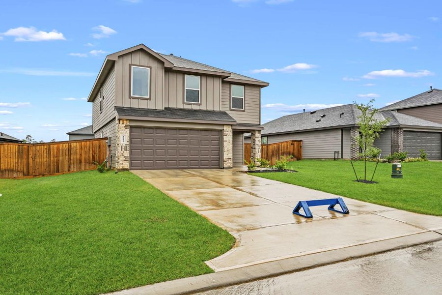 Front exterior of a new home in Mill Creek, Magnolia, TX, highlighting curb appeal (Image 16).
