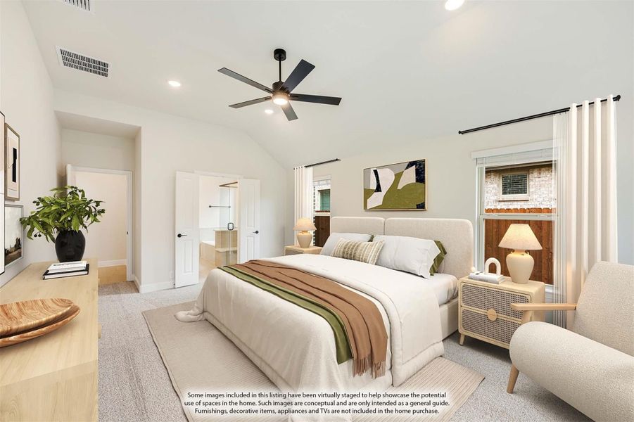 Bedroom with vaulted ceiling, ceiling fan, carpet flooring, and walk-in closet entrance Bedroom with vaulted ceiling, ceiling fan, carpet flooring, and walk-in closet entrance