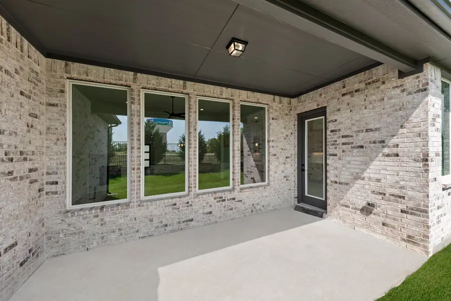 Exterior details and patio area of a home in Nelson Lake Estates, Rockwall (Image 2).