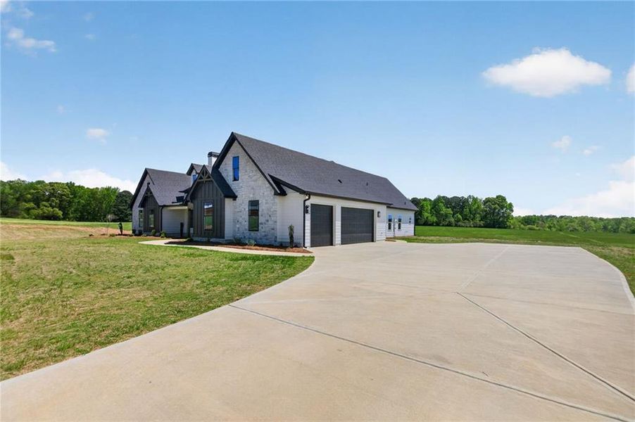 Front exterior of a new home in The Meadows at Lake Circle, Buchanan, GA, highlighting curb appeal (Image 27).