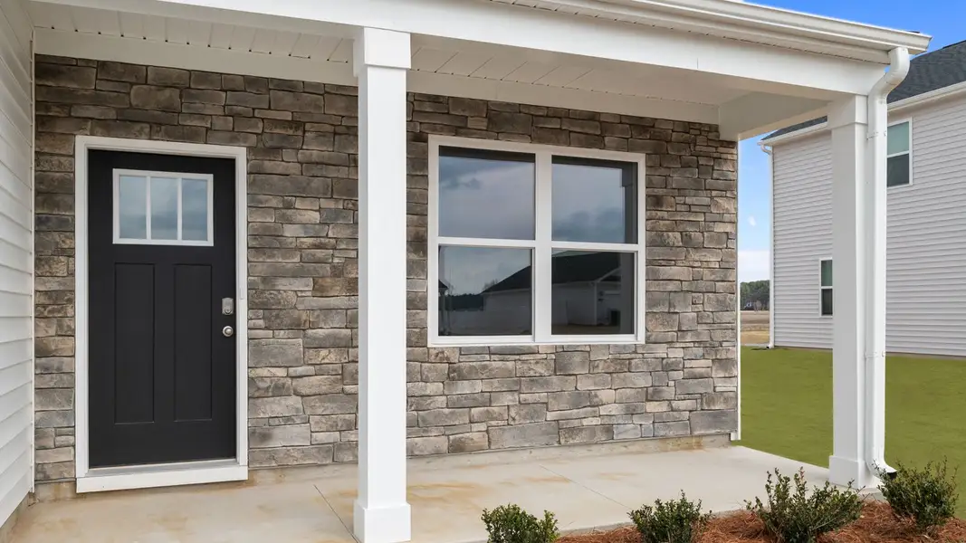 Exterior details and patio area of a home in East Ridge, Ayden (Image 3). Exterior details and patio area of a home in East Ridge, Ayden (Image 3).